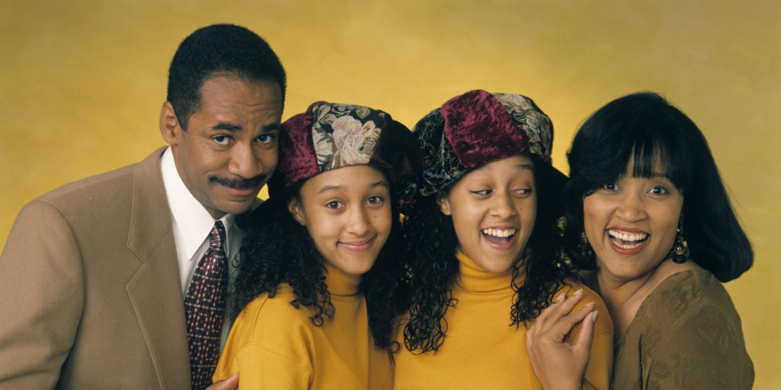 Photo from TV show "Sister, Sister" with Ray, Lisa, Tia, and Tamera against a yellow background.