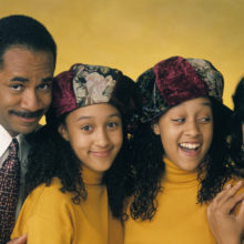 Photo from TV show "Sister, Sister" with Ray, Lisa, Tia, and Tamera against a yellow background.