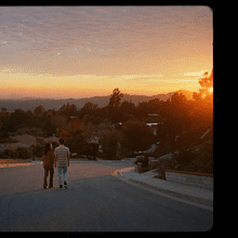 Still from a McDonald's commercial, a couple walking at sunset.