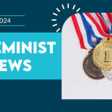 Graphic featuring gold, silver, and bronze medals on ribbons, with "July 2024" alongside "Feminist News" against a teal and navy backdrop.